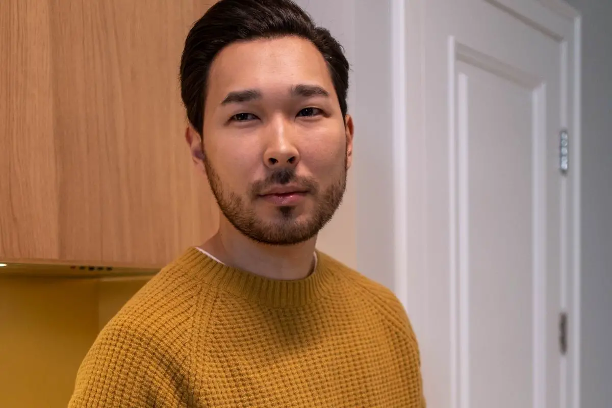 Beefy bear asian man face with a beard that make him manly