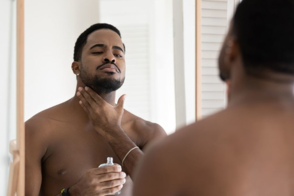 applying oil to beard