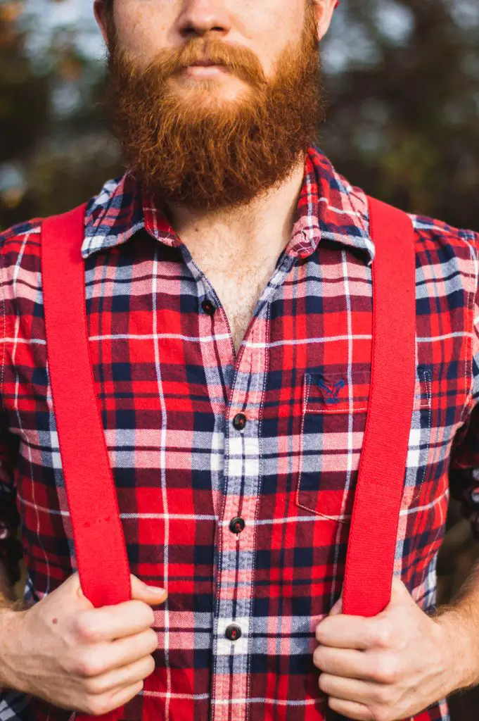 Man with long red beard posing in a forest. So Why is My Beard Partially Red?